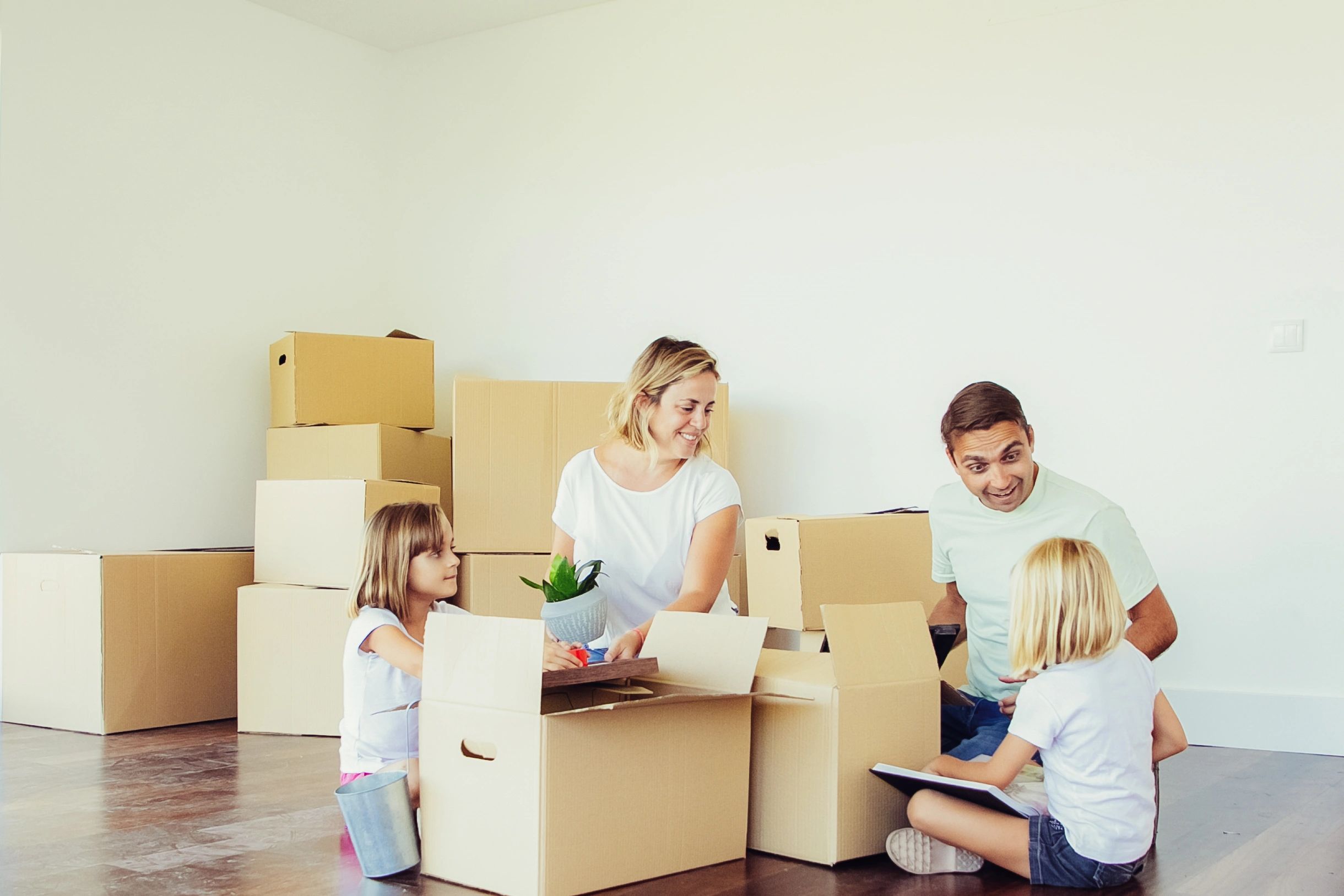 Family preparing for a move in a new apartment